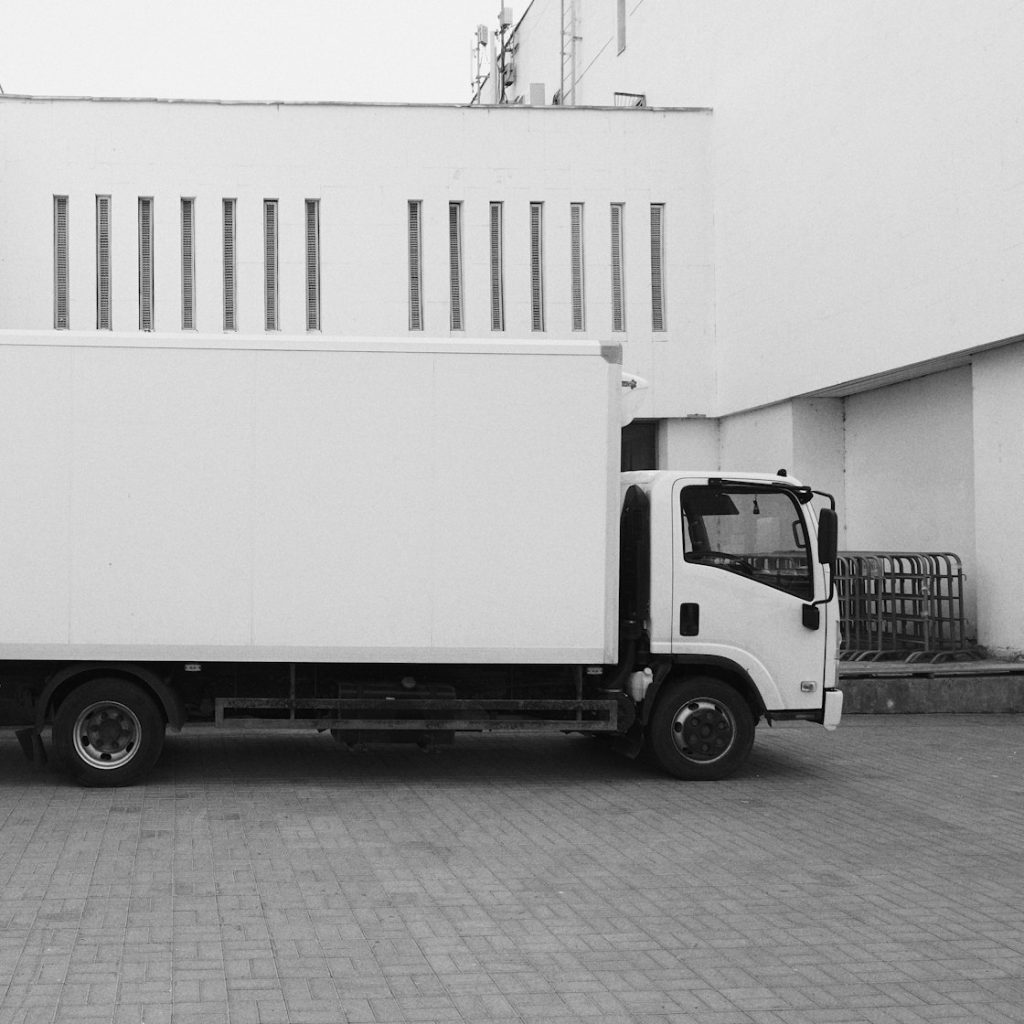 Local moving truck parked outside a residential building