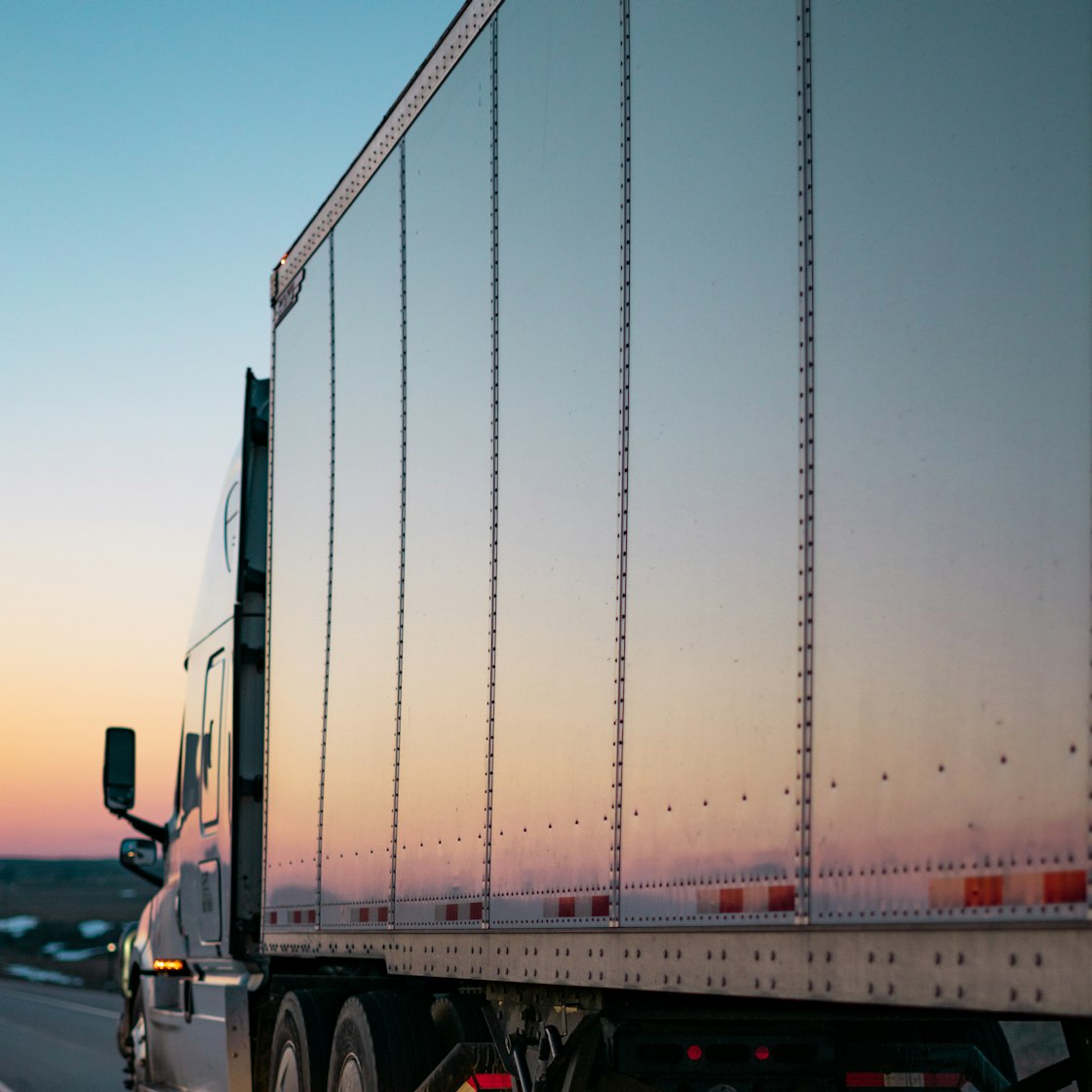 Long-haul moving truck on the highway leaving Dallas